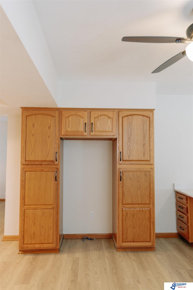 kitchen with light hardwood / wood-style flooring and ceiling fan