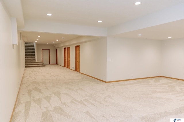 interior space featuring light colored carpet