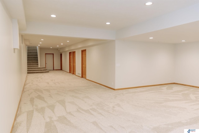 803 N 30th Rd, Syracuse, NE 68446 - finished below grade area with light carpet, recessed lighting, and stairs