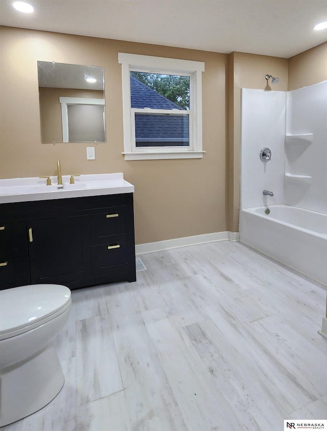 full bathroom featuring shower / bathing tub combination, vanity, toilet, and hardwood / wood-style flooring