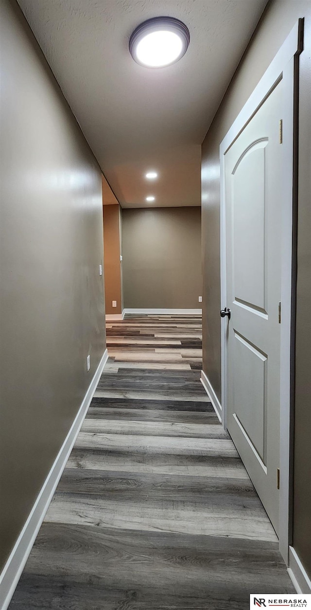 staircase featuring hardwood / wood-style flooring