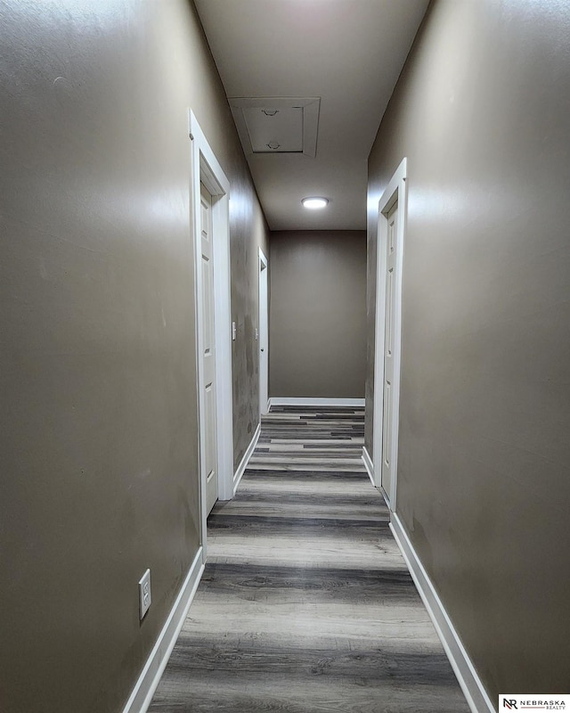 hallway with dark hardwood / wood-style floors