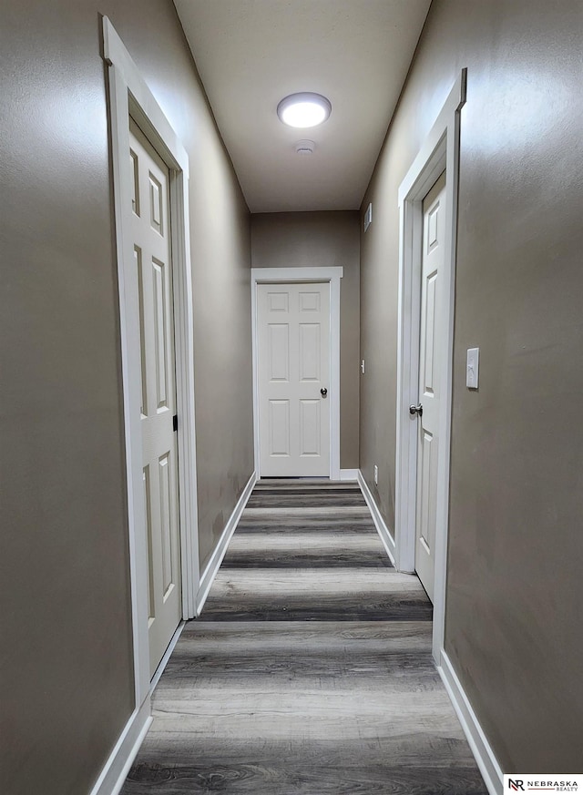 hall featuring dark wood-type flooring