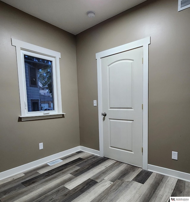 empty room featuring hardwood / wood-style flooring