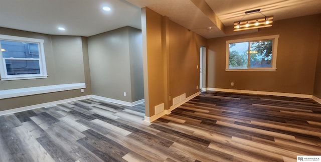 spare room with dark wood-type flooring