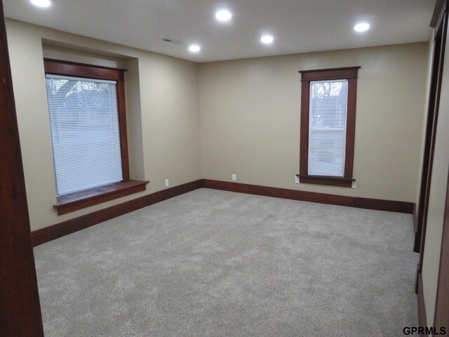 empty room featuring light colored carpet