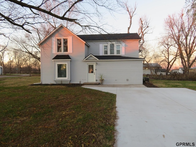 view of property featuring a yard