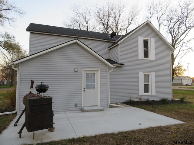 rear view of house featuring a patio