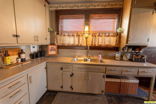 706 1st Ave, Nebraska City, NE 68410 - kitchen featuring a sink, light countertops, and white cabinetry