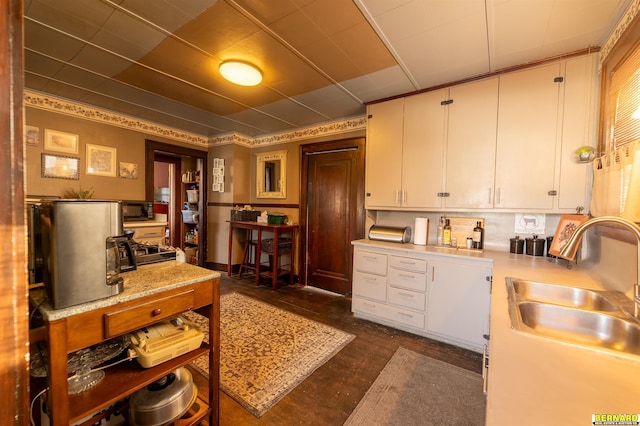 706 1st Ave, Nebraska City, NE 68410 - kitchen with light countertops, white cabinetry, black microwave, and a sink