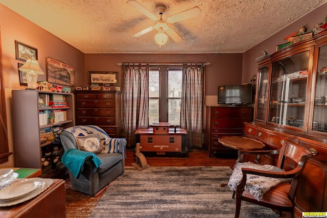 706 1st Ave, Nebraska City, NE 68410 - sitting room with a textured ceiling, wood finished floors, and a ceiling fan