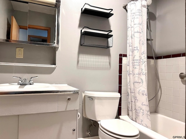 full bathroom with shower / bath combo, vanity, and toilet