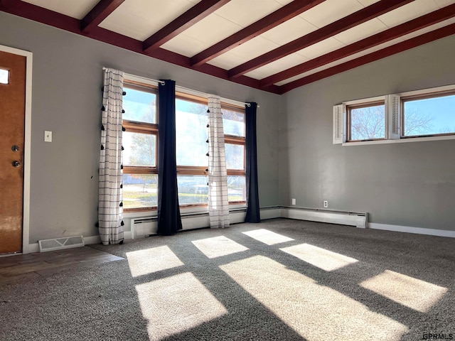 empty room with hardwood / wood-style floors and lofted ceiling with beams