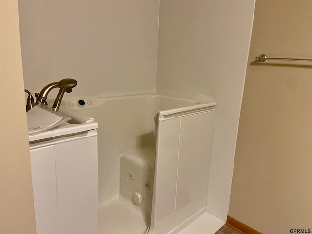 bathroom featuring a tub to relax in