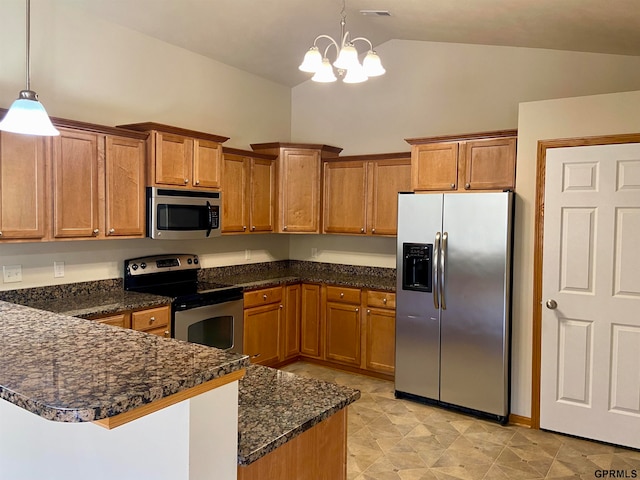 kitchen with lofted ceiling, an inviting chandelier, dark stone countertops, decorative light fixtures, and stainless steel appliances