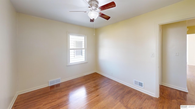 empty room with wood-type flooring and ceiling fan