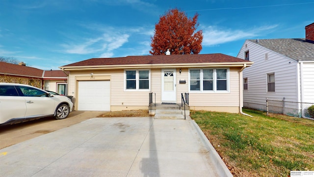 view of front of house featuring a garage and a front yard