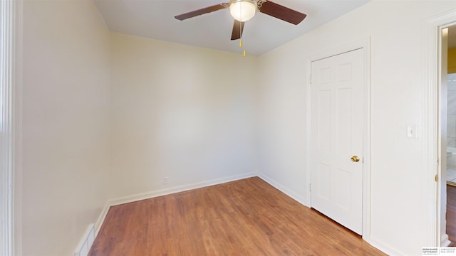 spare room with ceiling fan and hardwood / wood-style floors