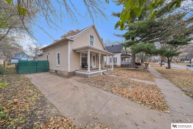 view of side of property with a porch