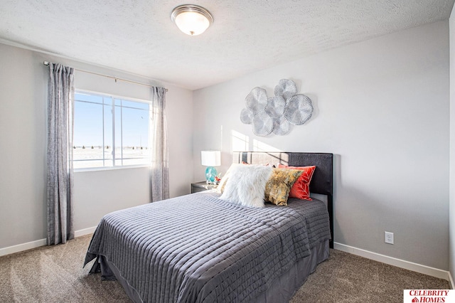 carpeted bedroom featuring a textured ceiling