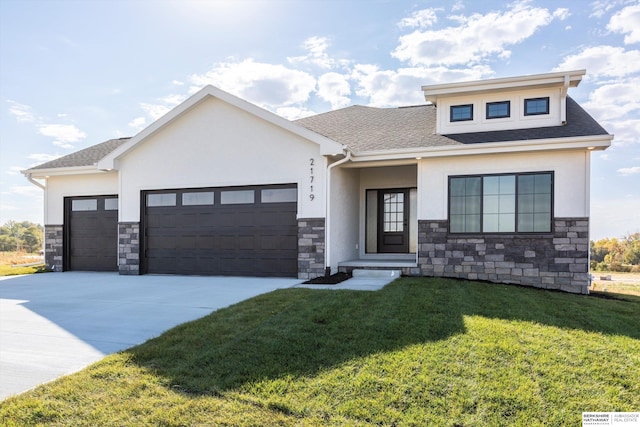 view of front facade featuring a garage and a front yard