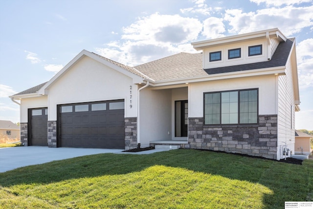 view of front of house with a garage and a front yard