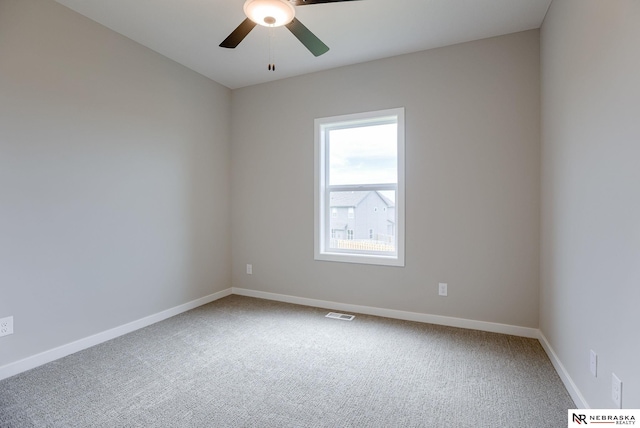 carpeted empty room featuring ceiling fan