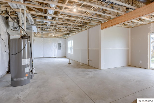 basement with electric panel and water heater