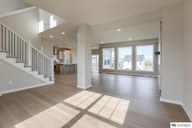 unfurnished living room with light wood-type flooring