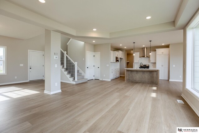 unfurnished living room featuring light hardwood / wood-style floors