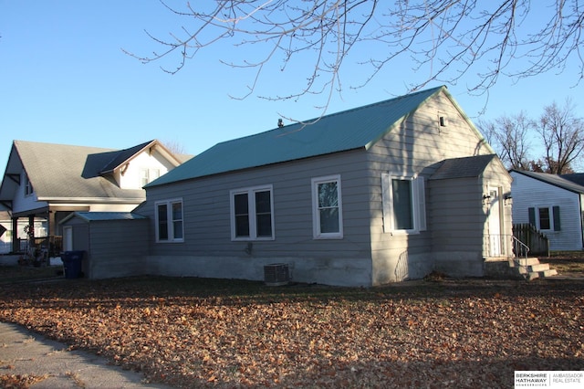 view of side of property featuring cooling unit