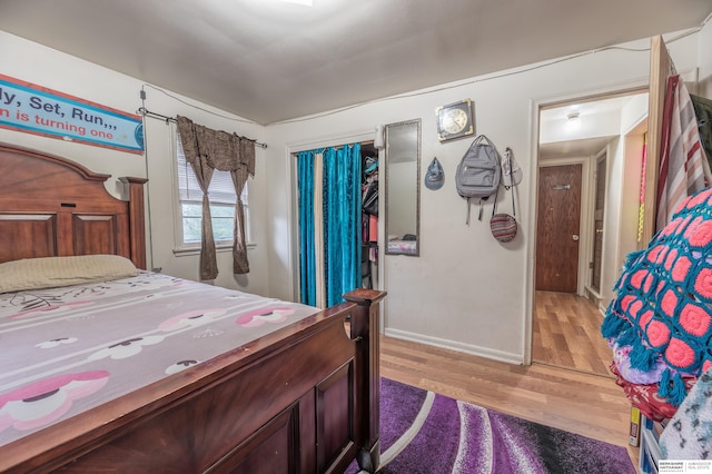 bedroom with light hardwood / wood-style floors