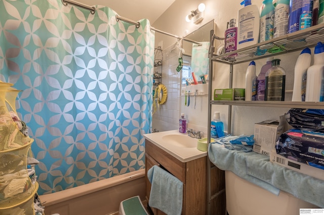 bathroom with vanity and shower / tub combo