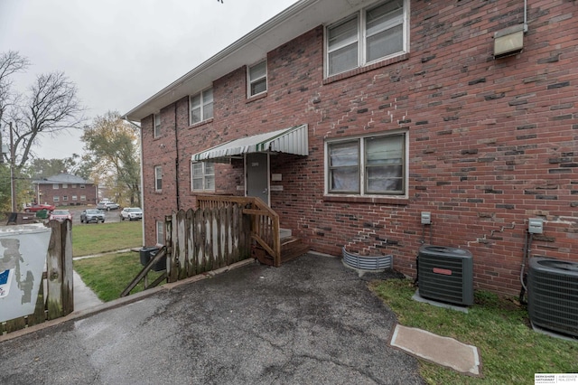 back of property with central AC unit