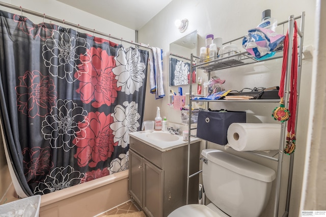 full bathroom with tile patterned flooring, shower / tub combo, vanity, and toilet