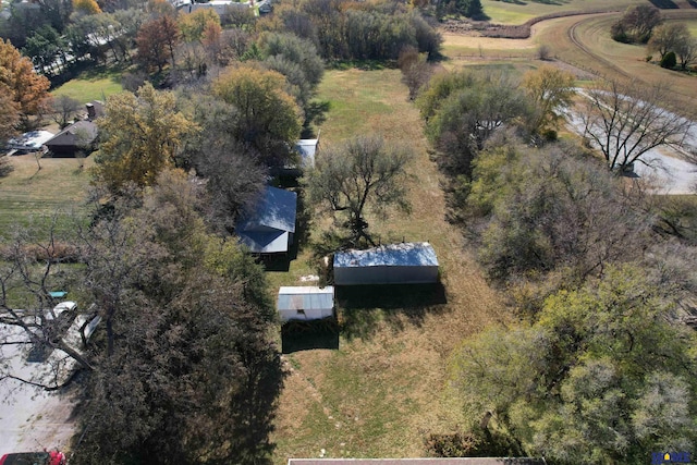 birds eye view of property with a rural view