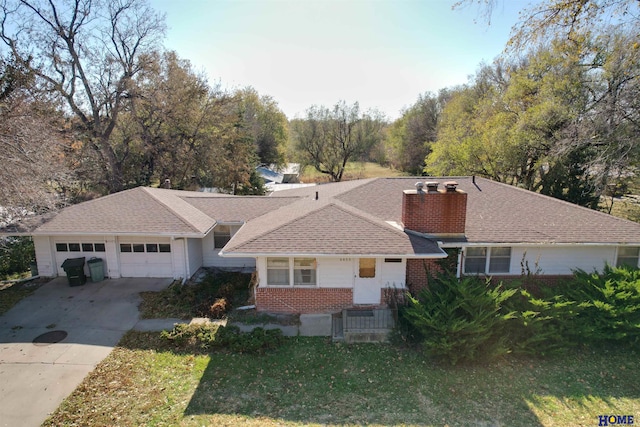 ranch-style house with a garage and a front lawn