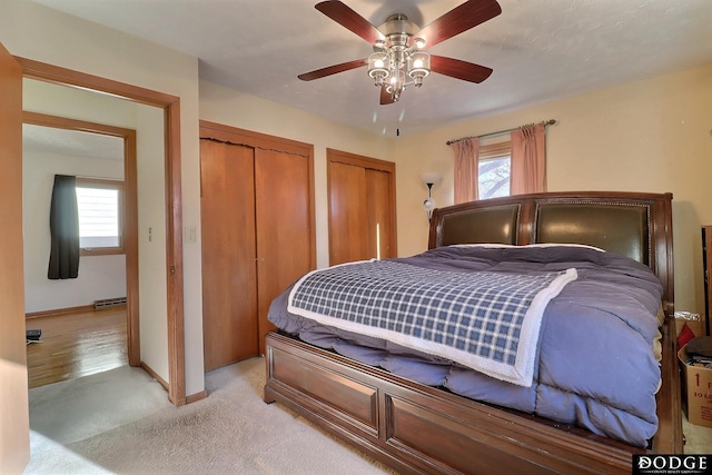 bedroom featuring ceiling fan and light carpet