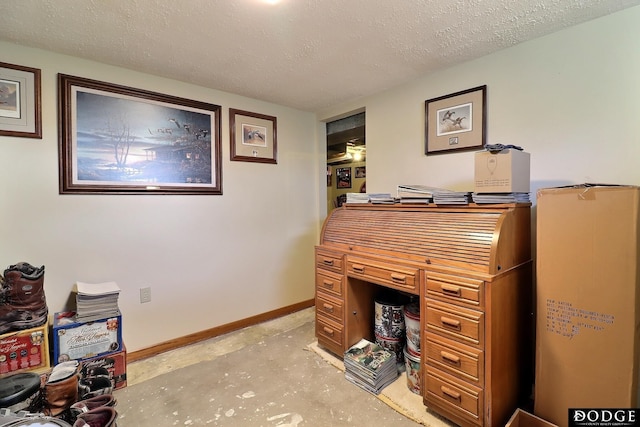 office space with a textured ceiling