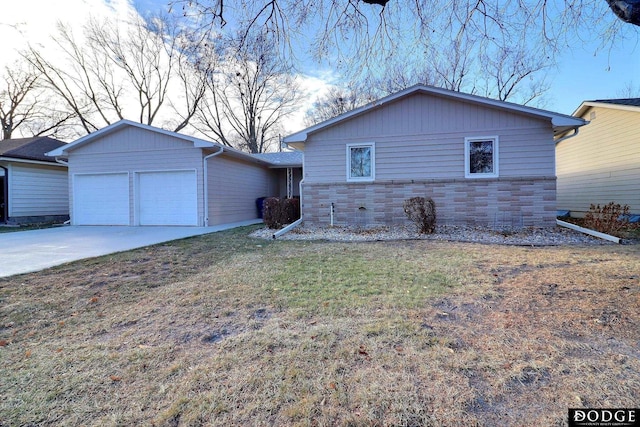 ranch-style house featuring a garage and a front lawn