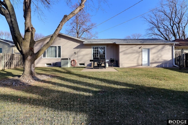 rear view of property with a patio area and a yard