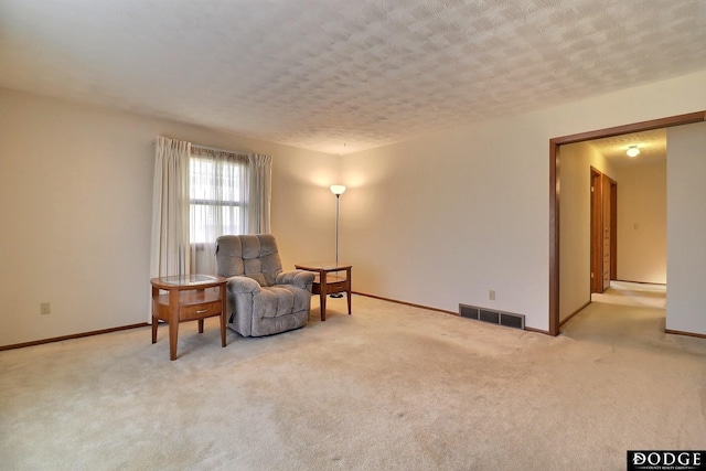 sitting room with light carpet