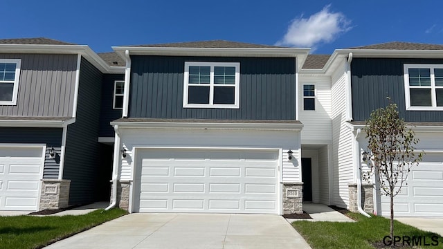 townhome / multi-family property featuring a garage