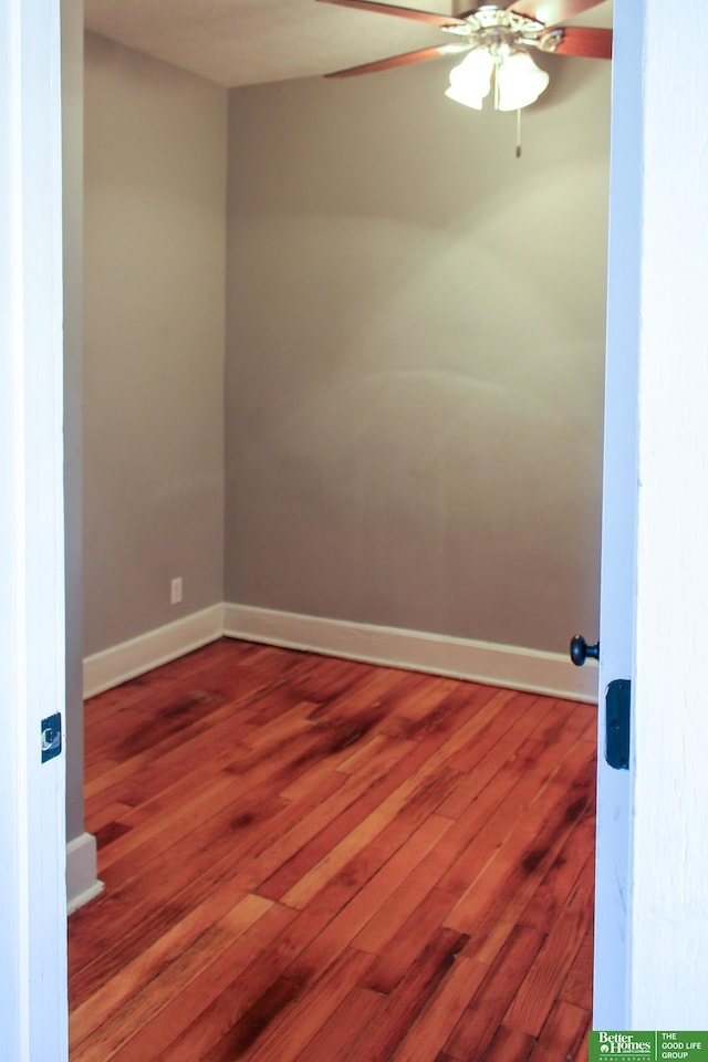 unfurnished room with hardwood / wood-style flooring and ceiling fan