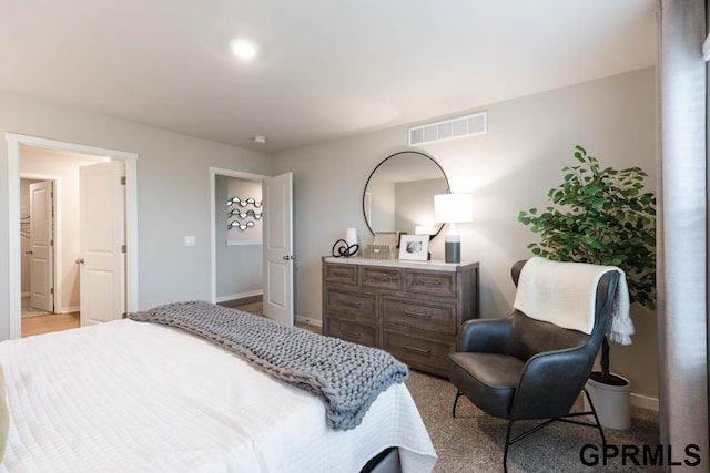 bedroom featuring light colored carpet