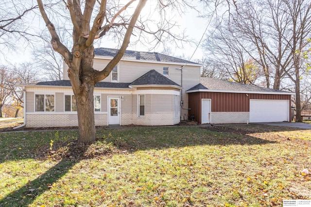 exterior space featuring a garage and a front lawn