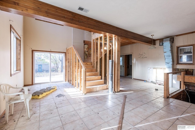 entryway with beam ceiling