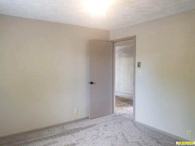 spare room with light colored carpet