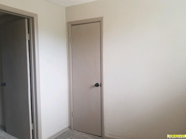 unfurnished bedroom with a closet