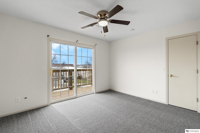 carpeted spare room featuring ceiling fan